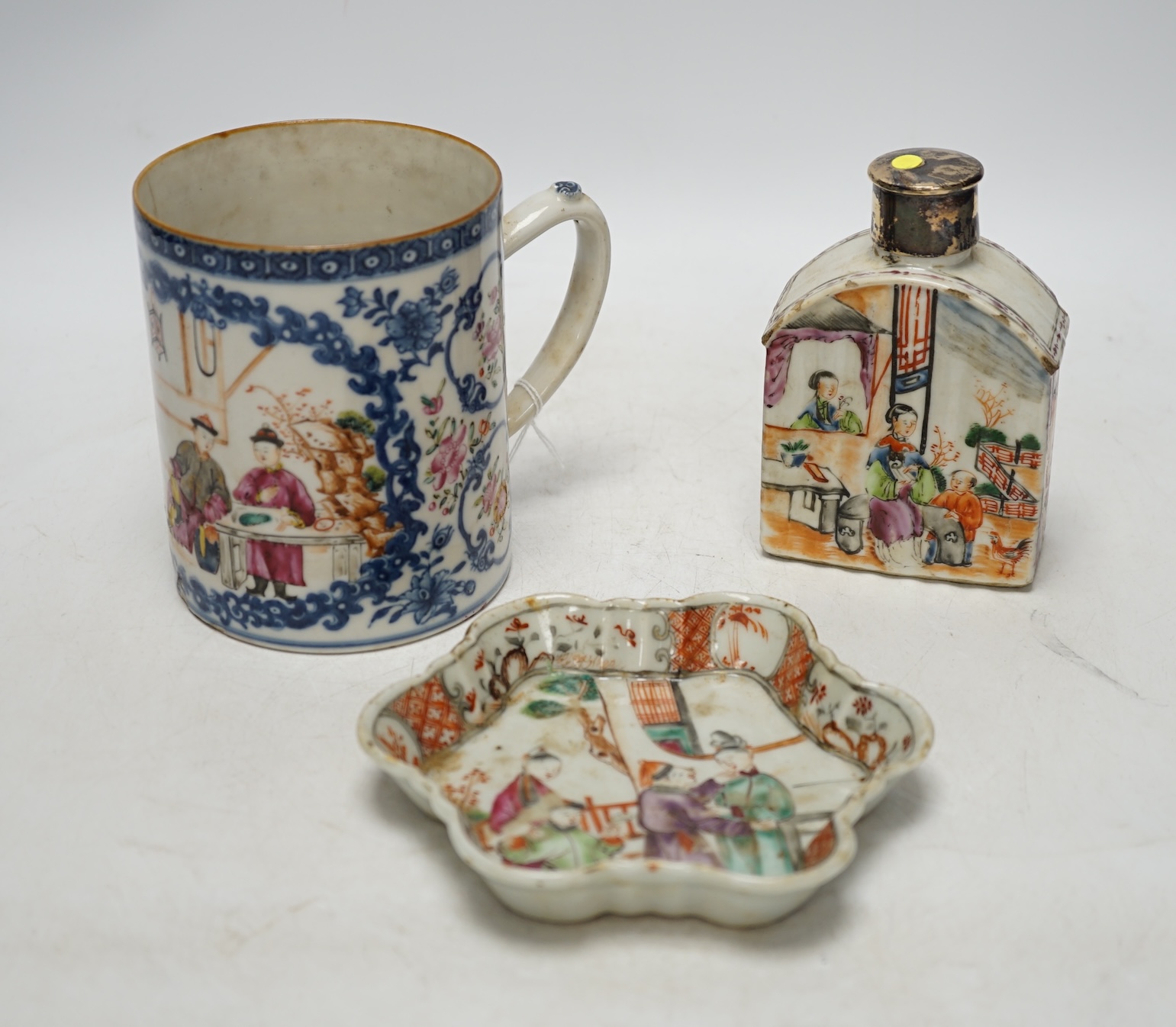 An 18th century Chinese export famille rose teapot stand, a mug and a tea canister, tallest 12cm. Condition - poor to fair